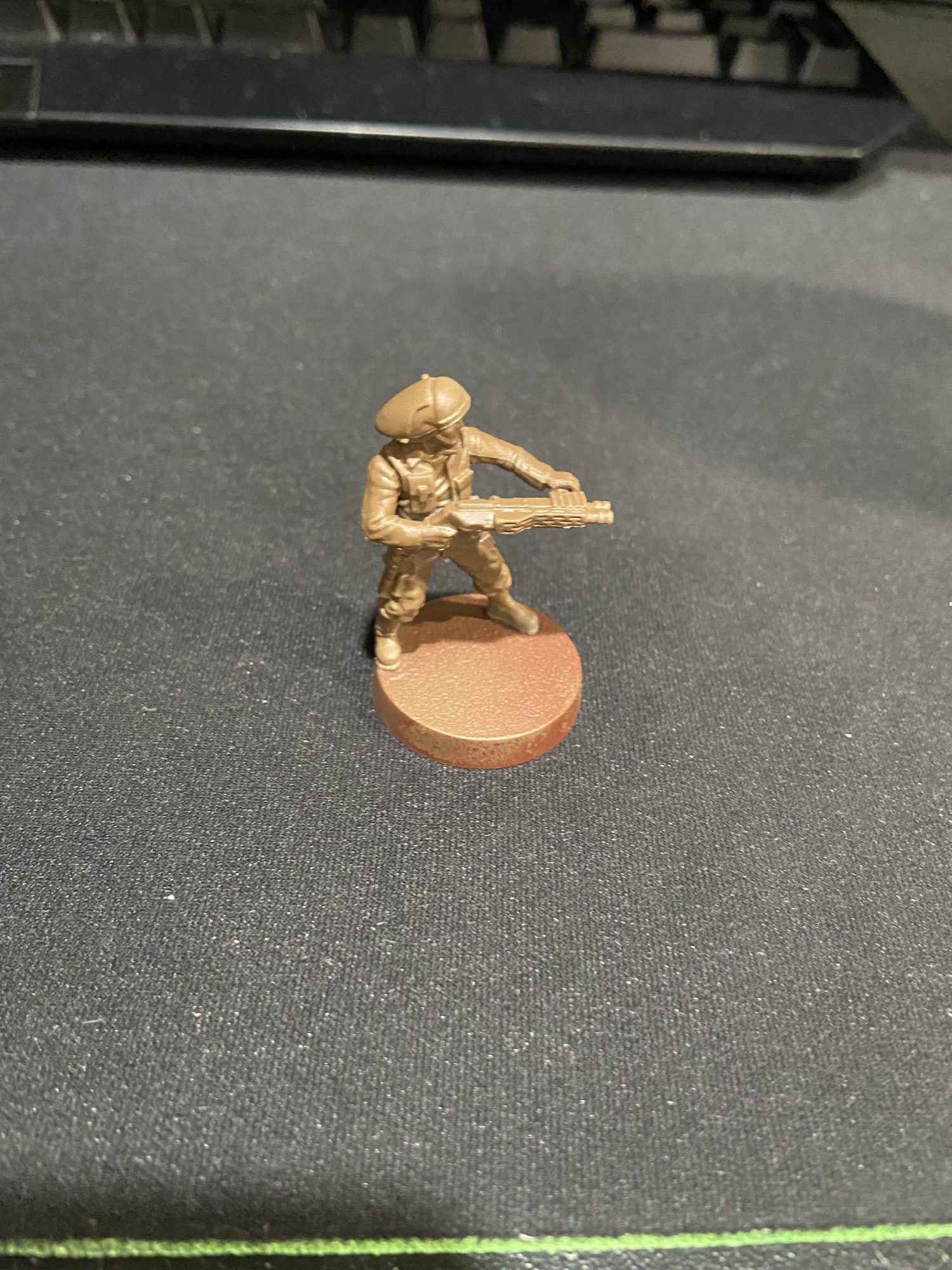 A Star Wars Legion Rebel base coated in brown. Credit Jon.Kil