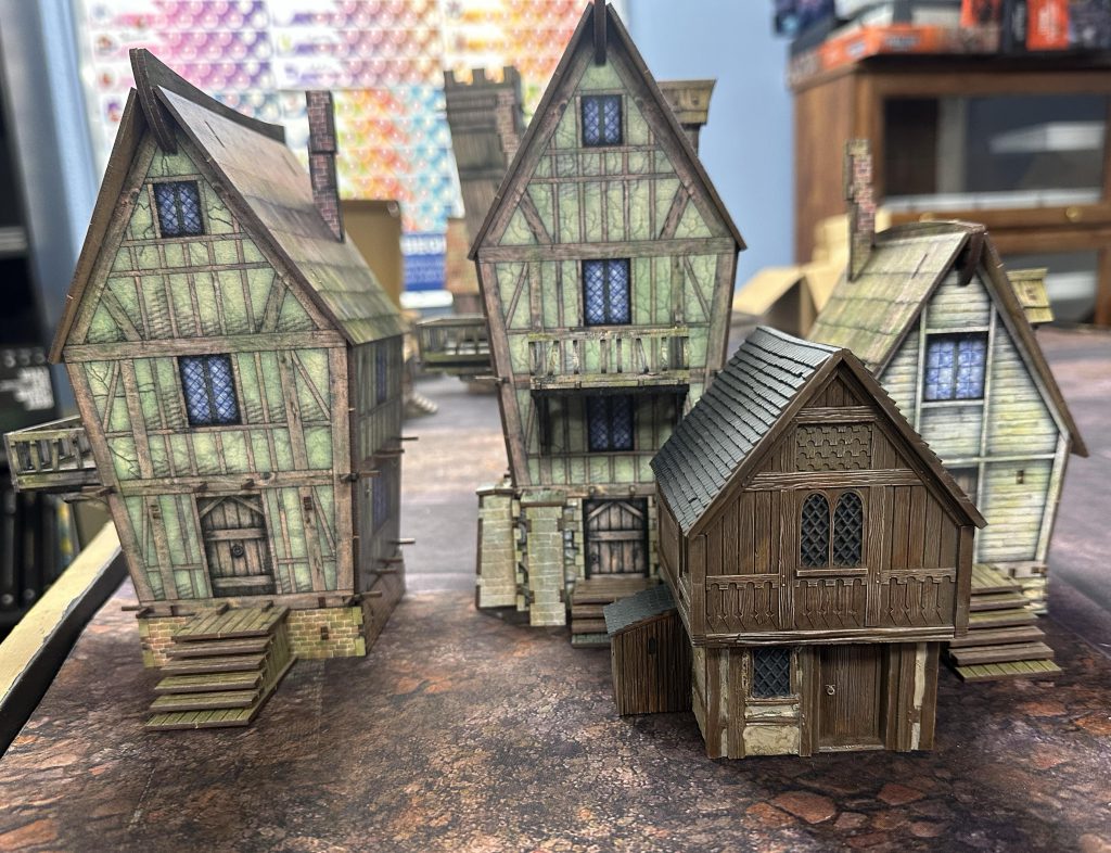 Three Tollingchester buildings and a GW Laketown building for scale
