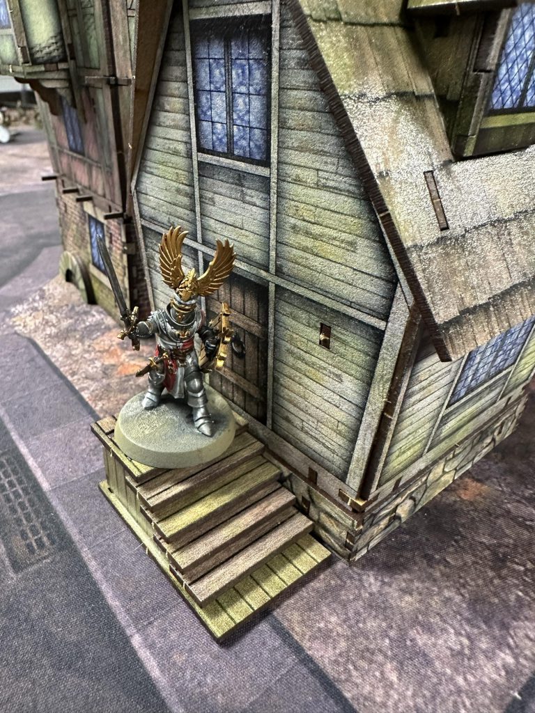 A knight in the door of a Tollingchester house